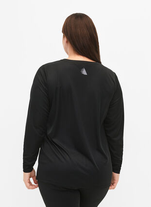 Long-sleeved training blouse with reflective details, Black, Model image number 1