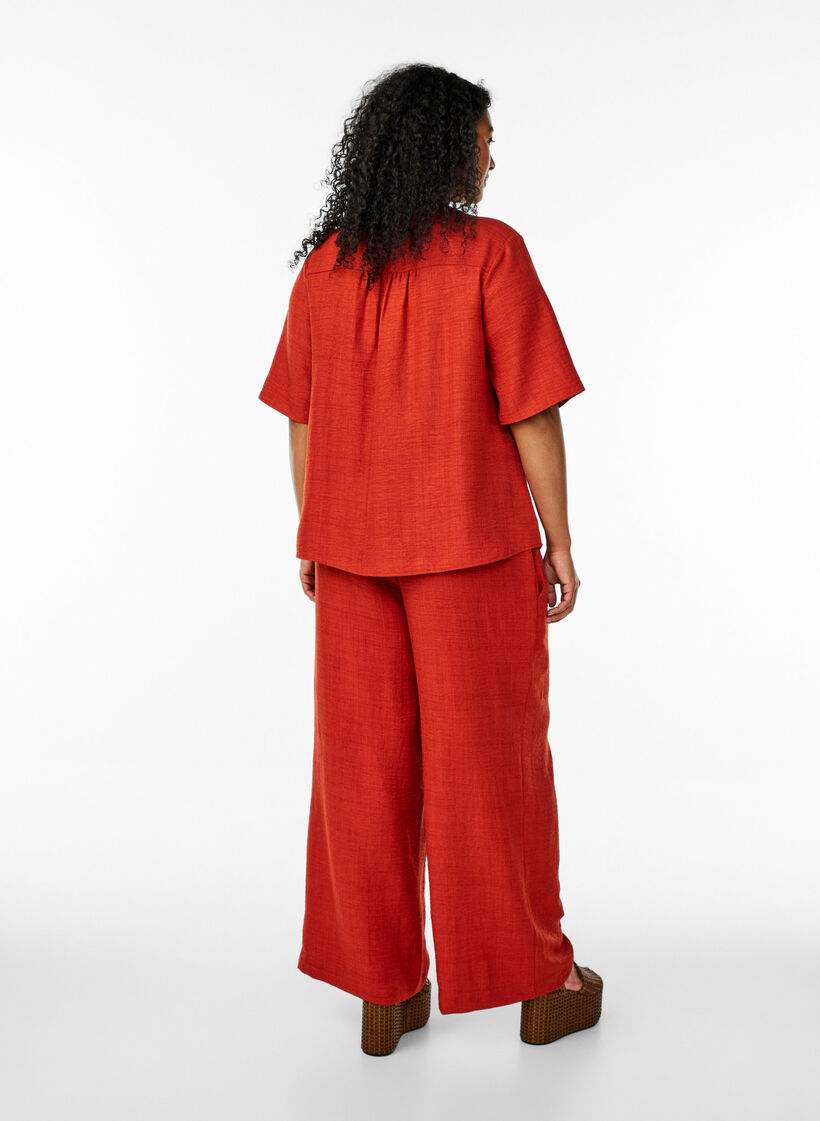 Loose trousers with elasticated waistband and pockets, Red, Model image number 1