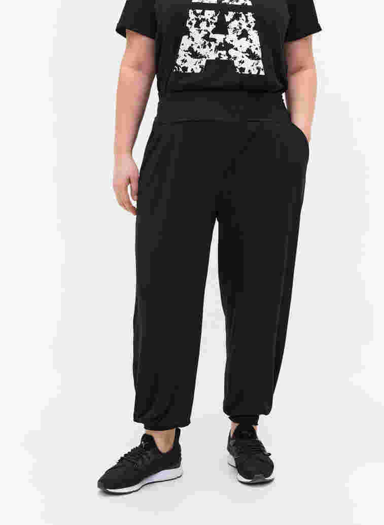 Loose viscose trousers with pockets, Black, Model image number 1