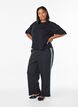 Trousers with side stripes, Black, Model image number 0