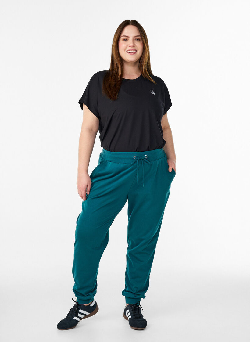 Loose tracksuit trousers with pockets, Green, Model image number 1