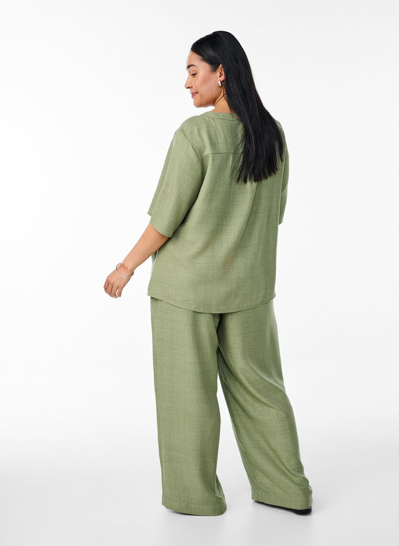 Loose trousers with elasticated waistband and pockets, Green, Model image number 1