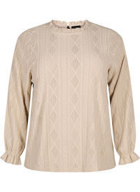 Blouse with ruffle details and tone-on-tone pattern