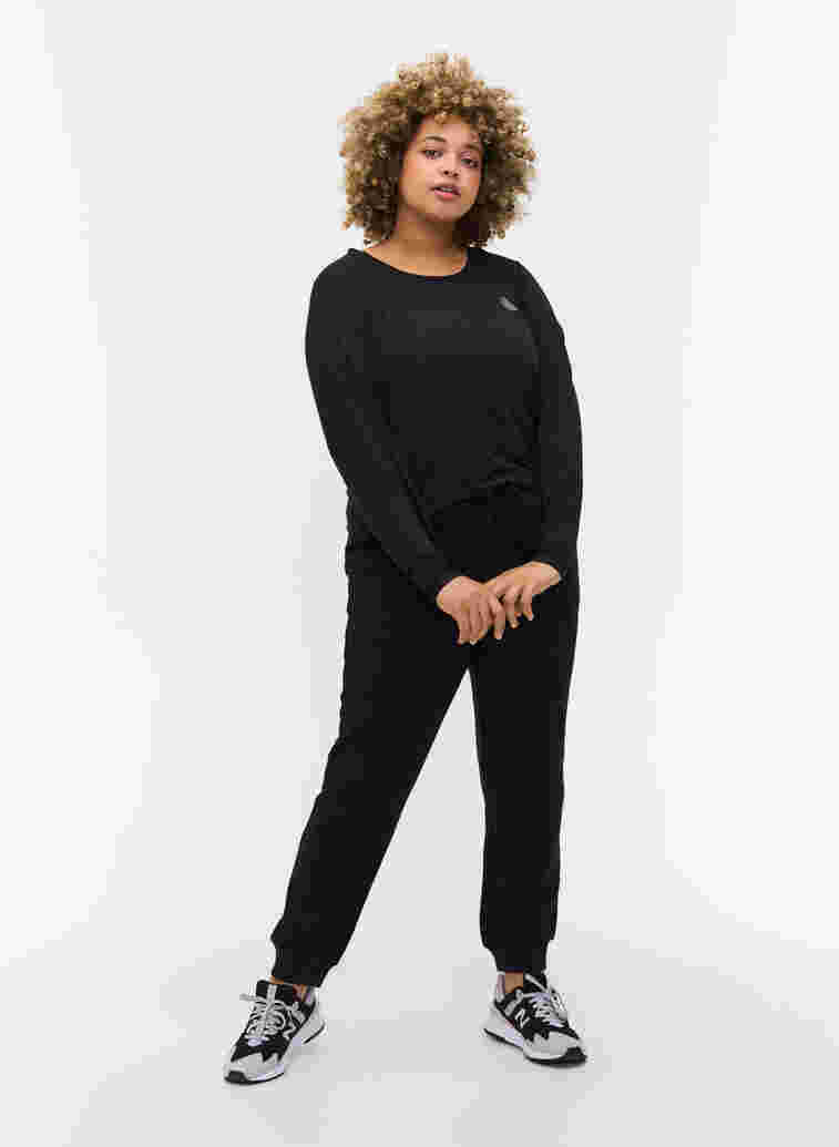 Plain sports pants with pockets, Black, Model