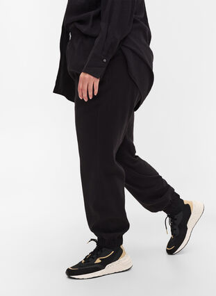 Loose viscose trousers with elastic borders and pockets, Black, Model image number 2