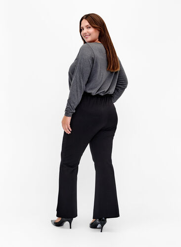 Trousers with bootcut and front slit, Black, Model image number 1