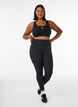 Training tights with a high waist and pocket in the waistband, Black, Model image number 0