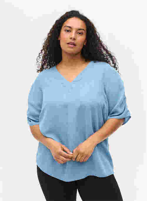 Blouse with draped sleeves
