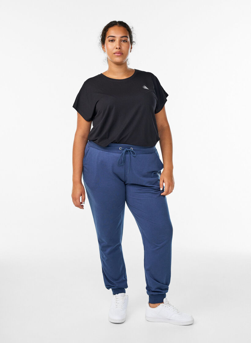 Loose workout trousers with pockets, Blue, Model image number 0
