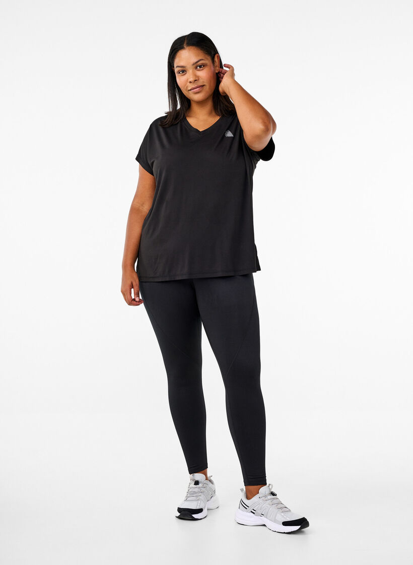 Training tights with fleece lining, Black, Model image number 1
