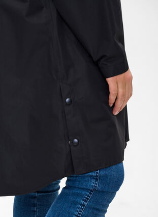 Raincoat with pockets and hood, Black, Model image number 2