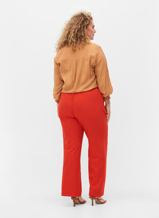 Flared trousers with pockets, Fiery Red, Model image number 1