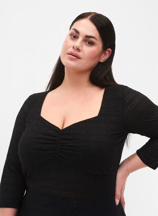Tight-fitting blouse with ruffled detail, Black, Model image number 2