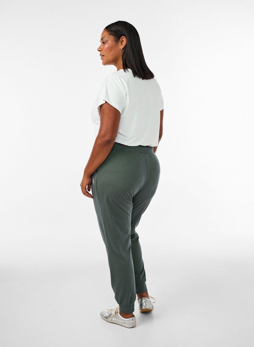 Loose tracksuit trousers with pockets, Green, Model image number 1