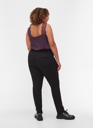 Tight-fitting trousers with pockets and a zipper, Black, Model image number 1