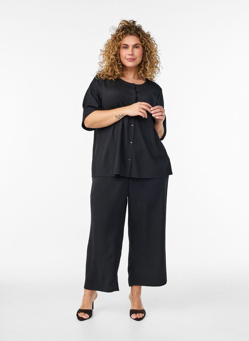 Short-sleeved blouse with texture and button fastening, Black, Model image number 1