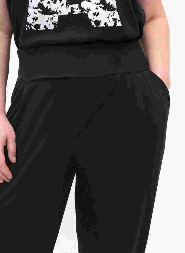 Loose viscose trousers with pockets, Black, Model image number 2