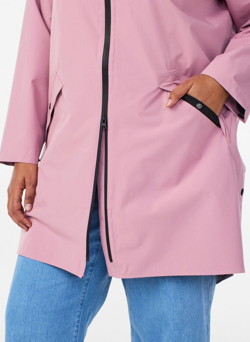 Rain jacket with pockets and a hood, Rose, Model