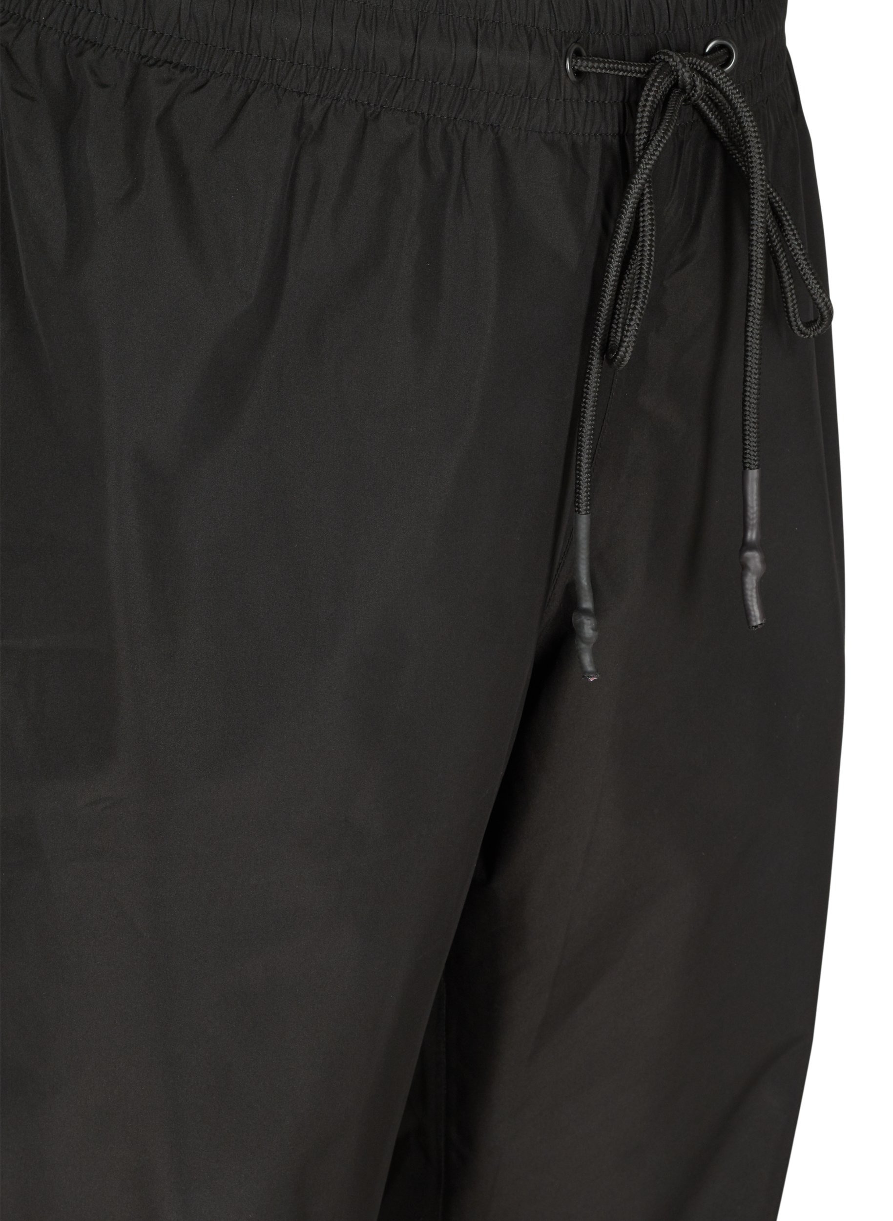 Rain trousers with elastic and 